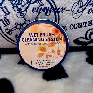 Wet brush cleaning system.